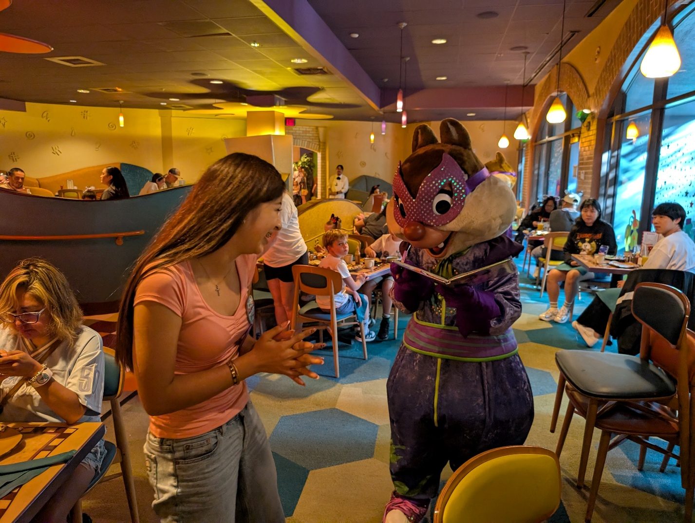 Dale signing an autograph book at Goofy’s Kitchen.