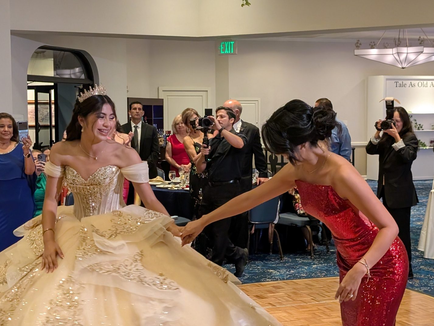 Mother and daughter dancing at the quinceañera party.