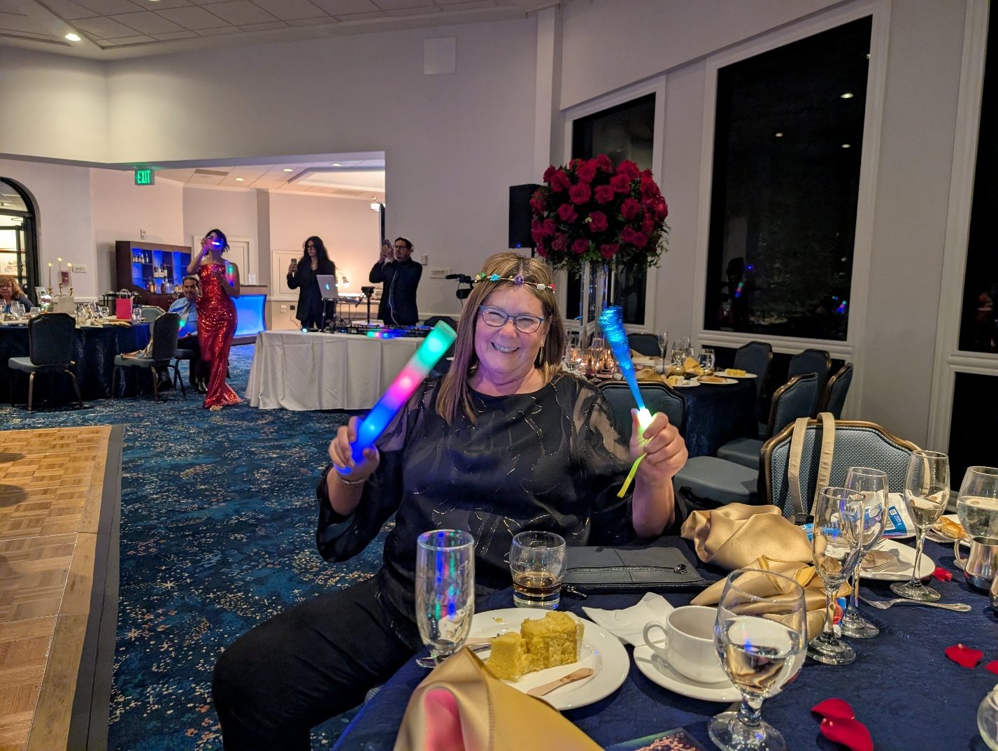 Guest sitting at a decorated party table.