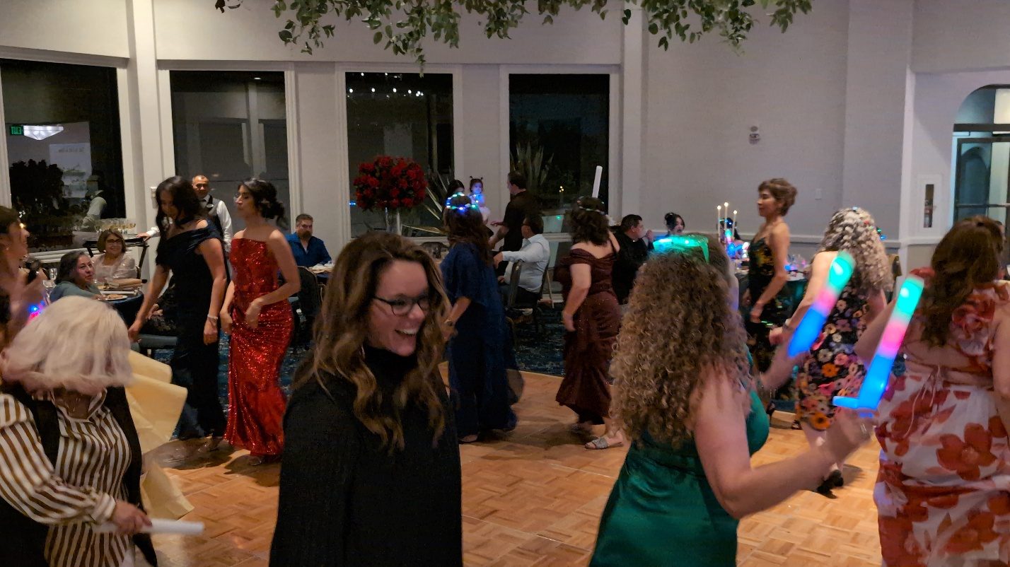 Guests dancing at the quinceañera party.