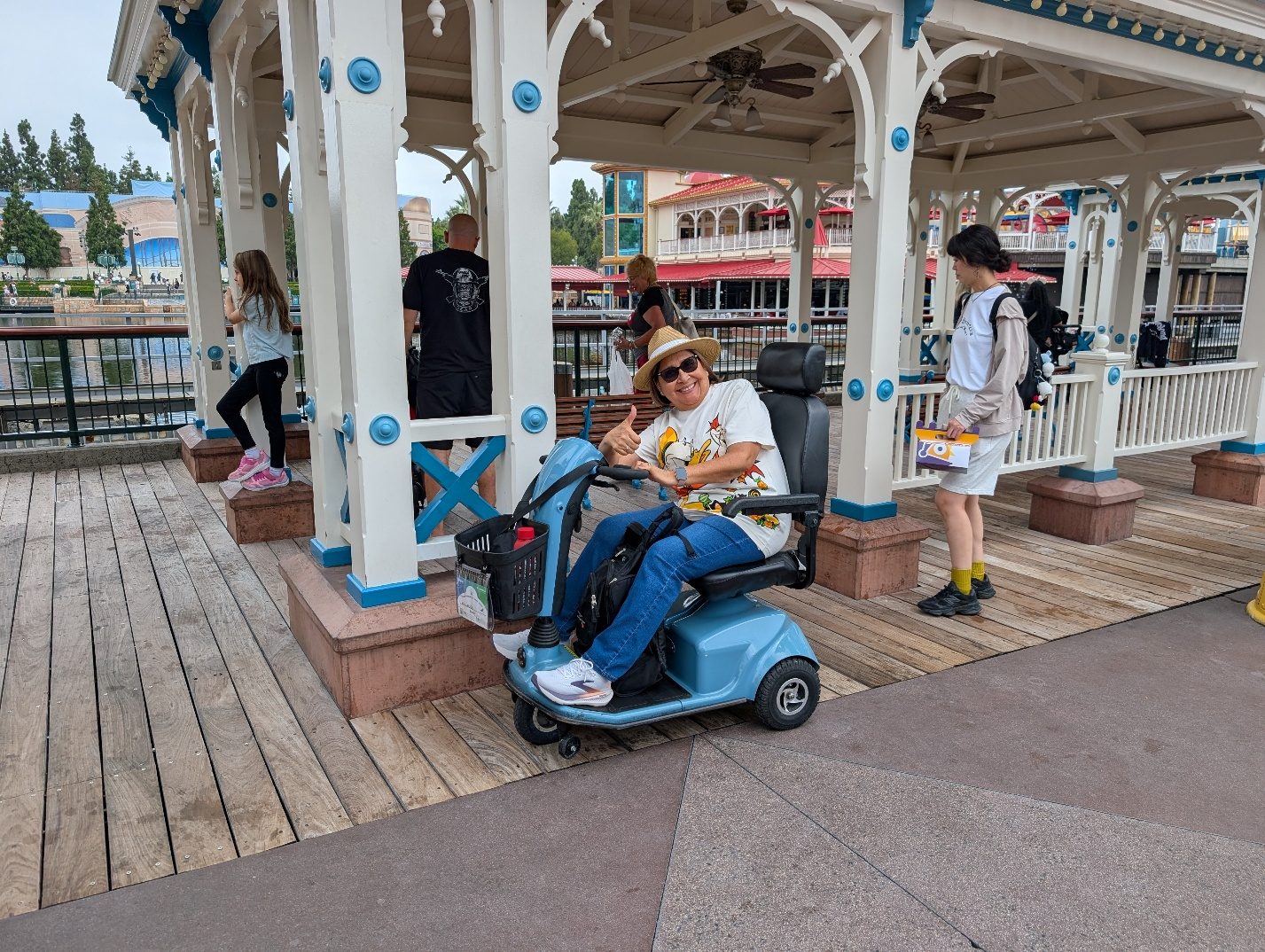 Guests using scooters in the park.