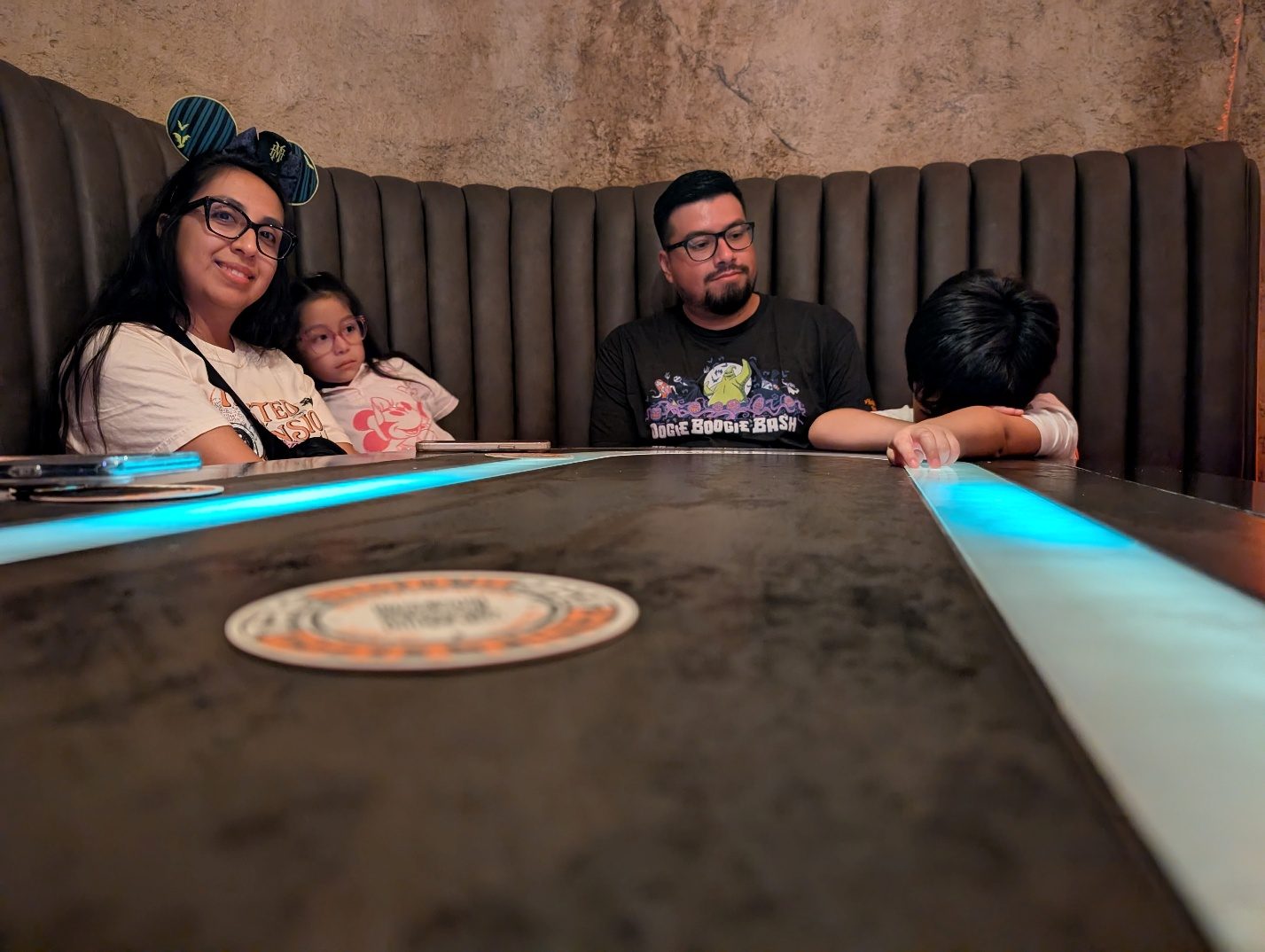 Family seated inside Oga’s Cantina.