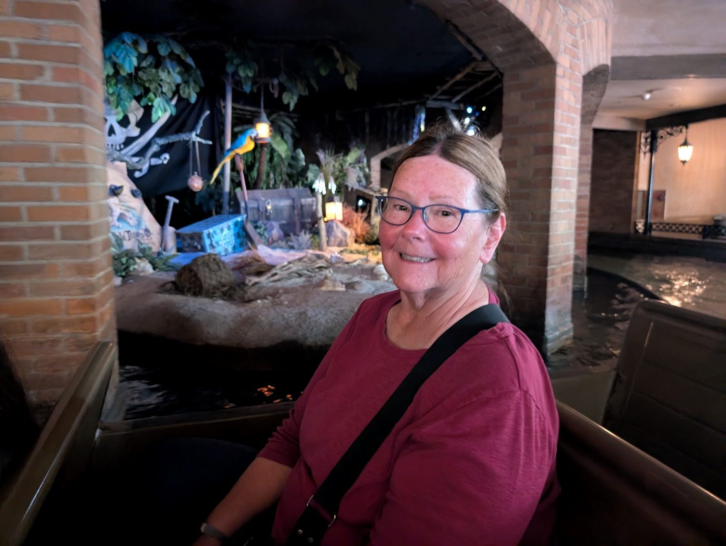 Guest posing beside a Pirates of the Caribbean scene.
