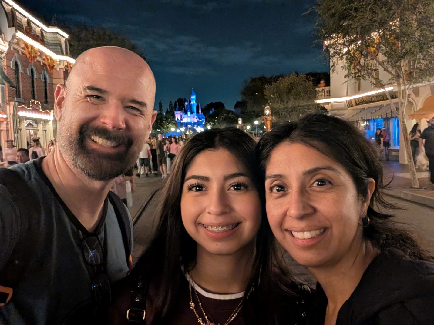 Family selfie on Main Street with the castle in the distance.