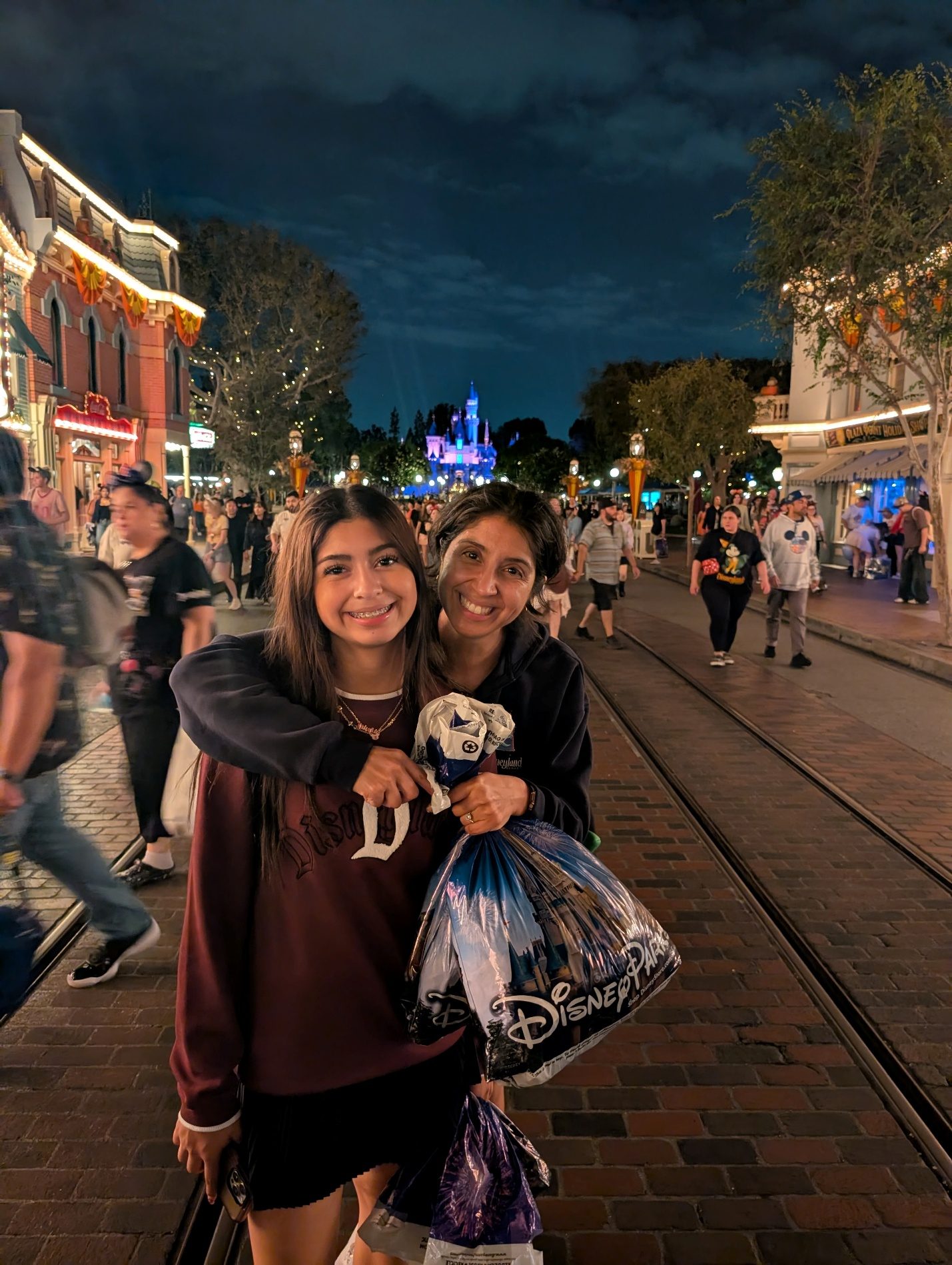 Couple photo on Main Street at night.