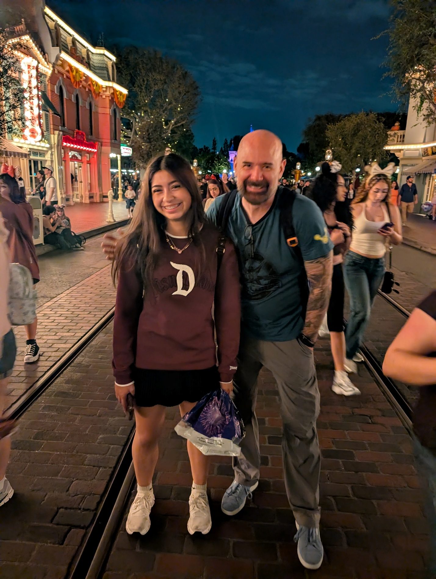 Couple photo on Main Street at night.