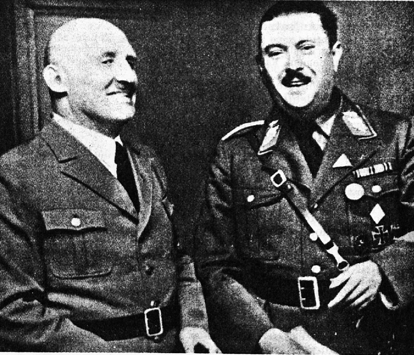 Black and white image of Julius Streicher speaking with Dr. Wagner.